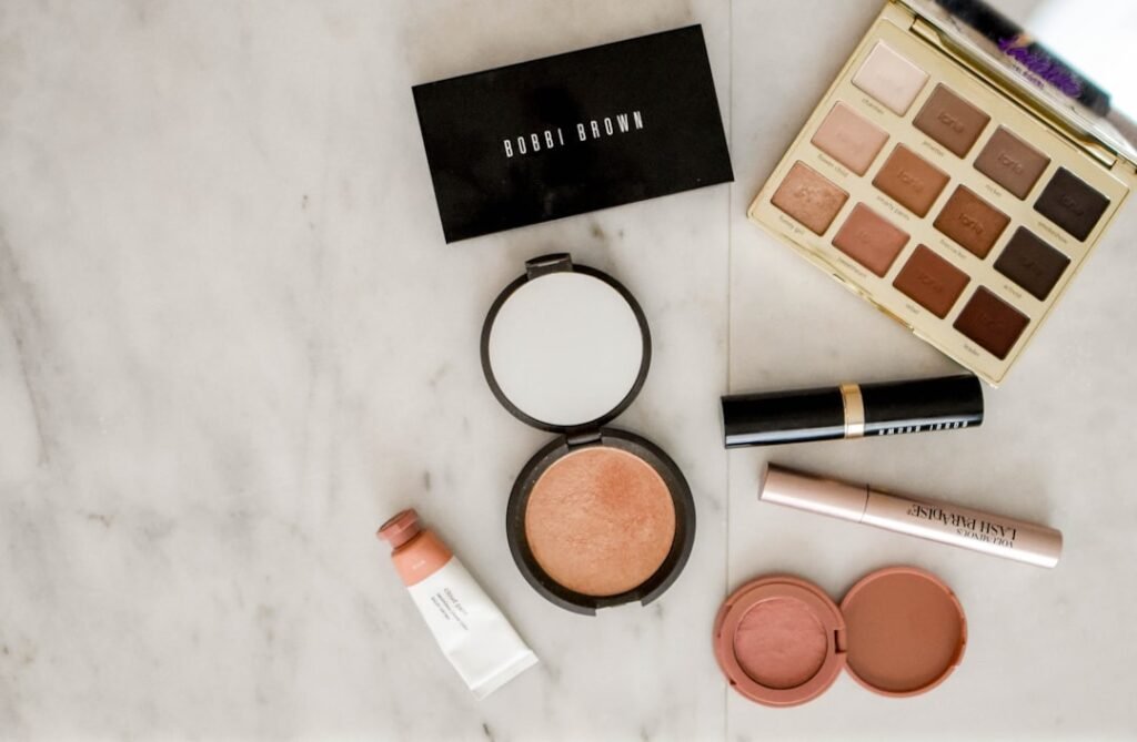 Beauty products and makeup arranged on a table