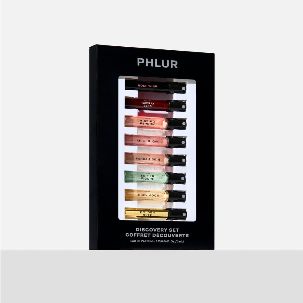 PHLUR Discovery Set with eight perfume samples displayed on a ledge